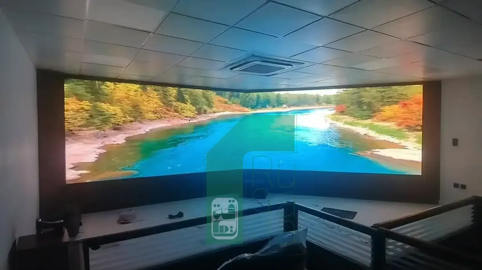 Ruqaqa command and control center with a large video wall showing multiple live data feeds