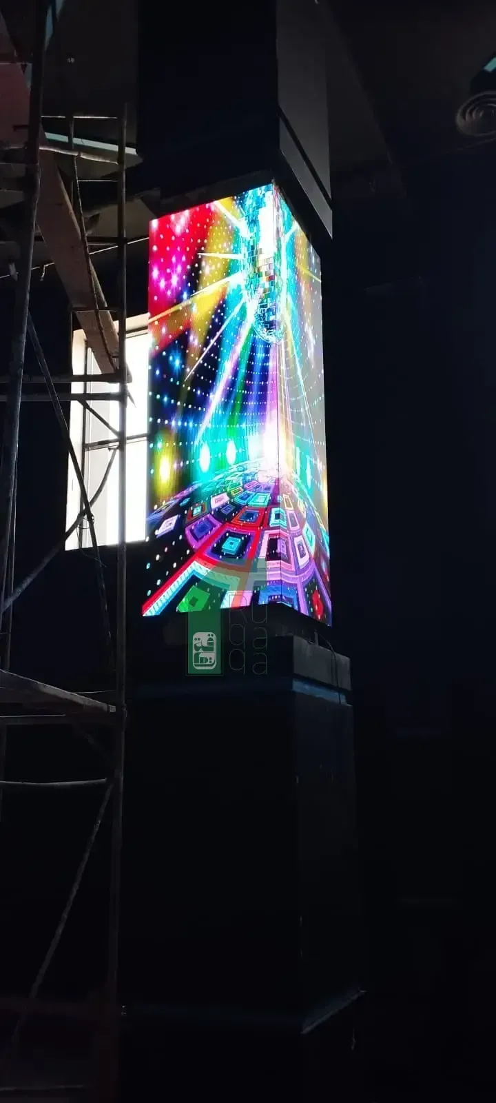 Ruqaqa vertical column LED display wrapped around a pillar showing vivid 360-degree digital content