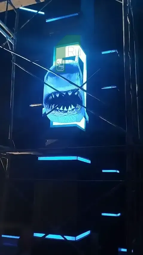 Ruqaqa column LED display on a pillar showing 3D shark content with blue lighting